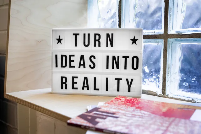 Picture of a slogan saying "turn ideas into reality"